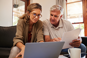 couple looking at their laptop