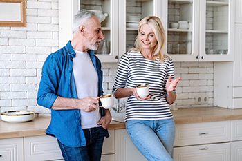 couple chatting in their kitchen